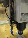 Closeup of the Cobra 2000 srop ejector system. One air supply line is used to create an oil spray.